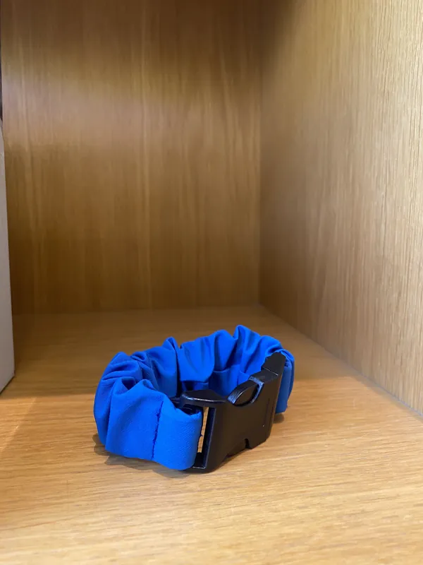 A Royal Blue strap on a wooden shelf